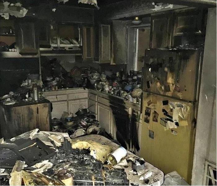 Kitchen fire burnt cabinets and appliances